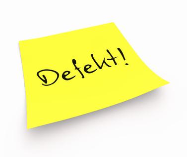 Gelber Klebe-Notizzettel mit der Aufschrift „Defekt“