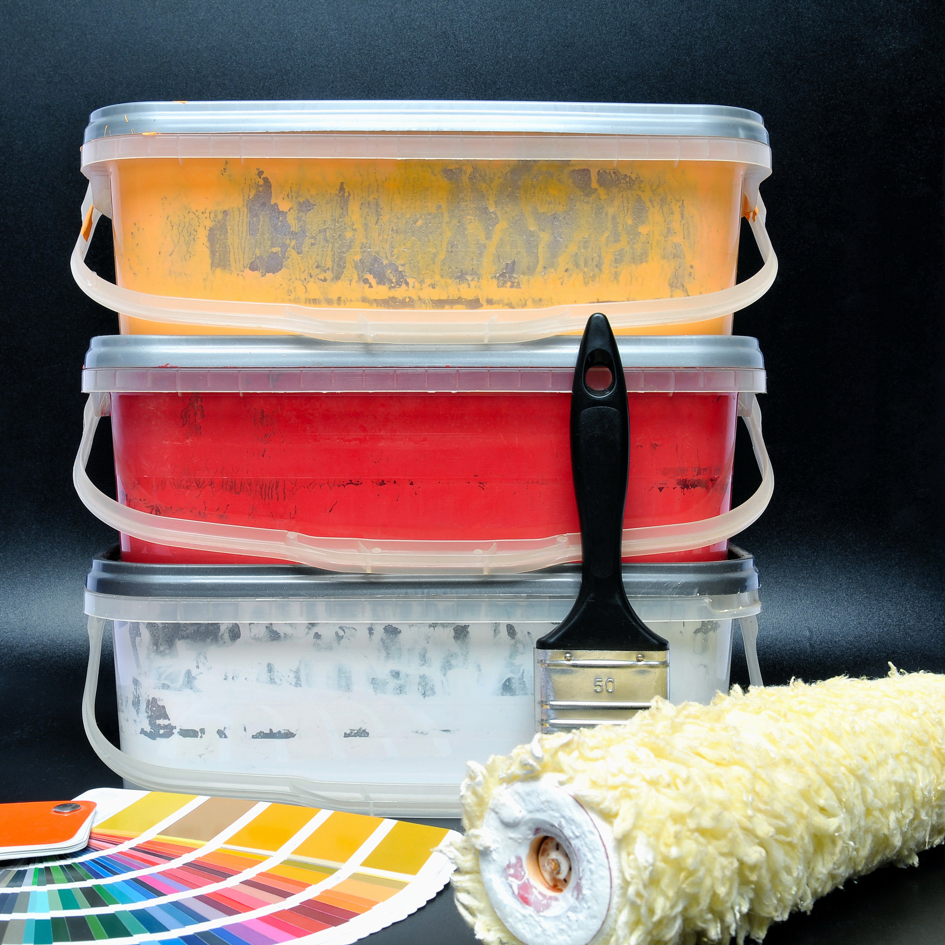 paint buckets, paint brush and paint roller
