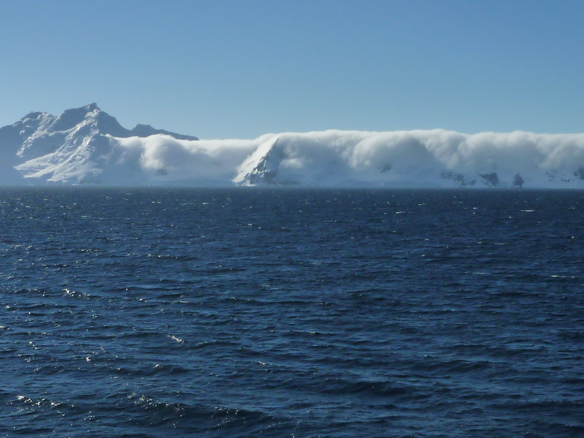 Despite sunshine, mountains near the coast are often hidden by low-lying clouds.