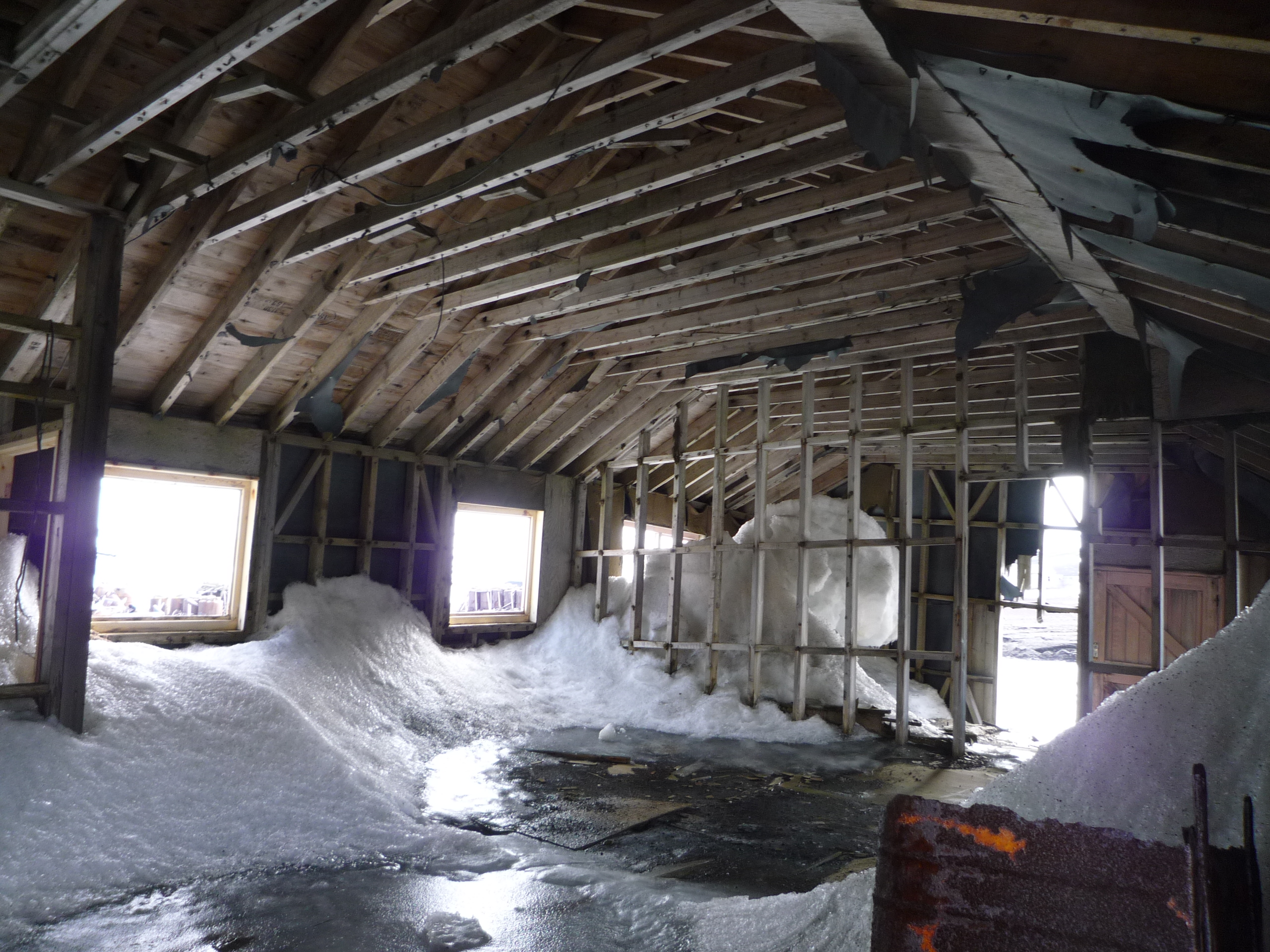 historical building in the antarctic with snow