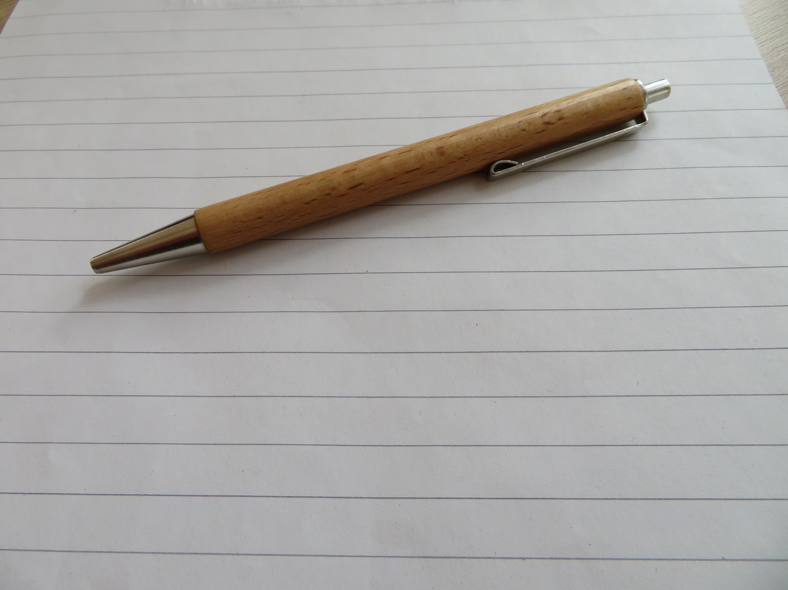 You can see a pen on a sheet of paper