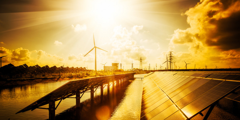 The picture shows solar panels as well as wind turbines.