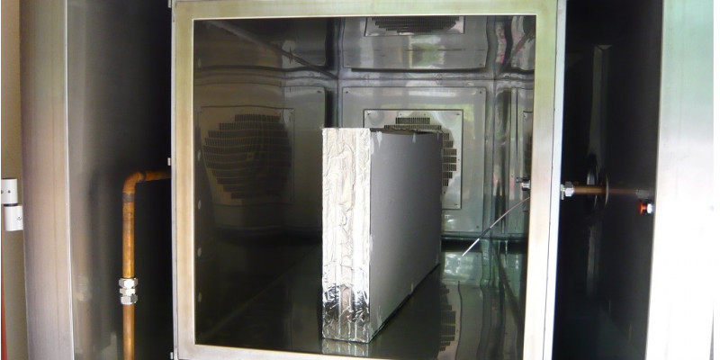 A gypsum board in an emissions testing chamber.