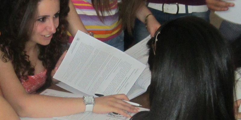 young women look in a document