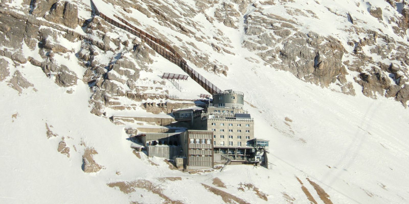 Building of the air quality measuring station on a snow-covered slope