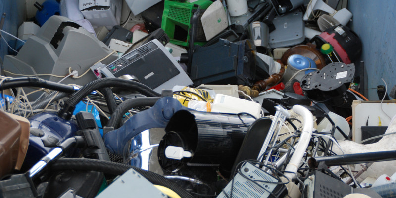 used electrical and electronic equipment in a container, for example monitors, computers and household appliances