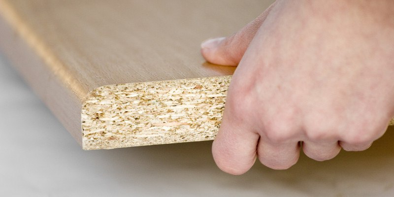 hand holding a flake board