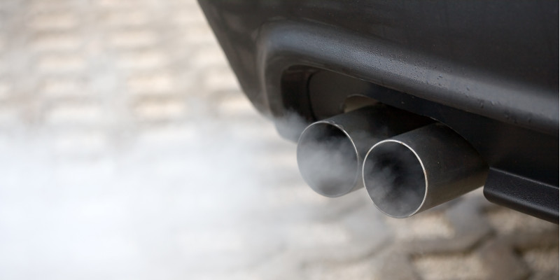 exhaust pipe of a car emitting exhaust gases