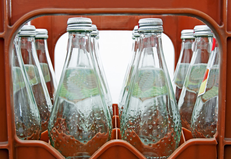 returnable glass bottles with mineral water in a crate