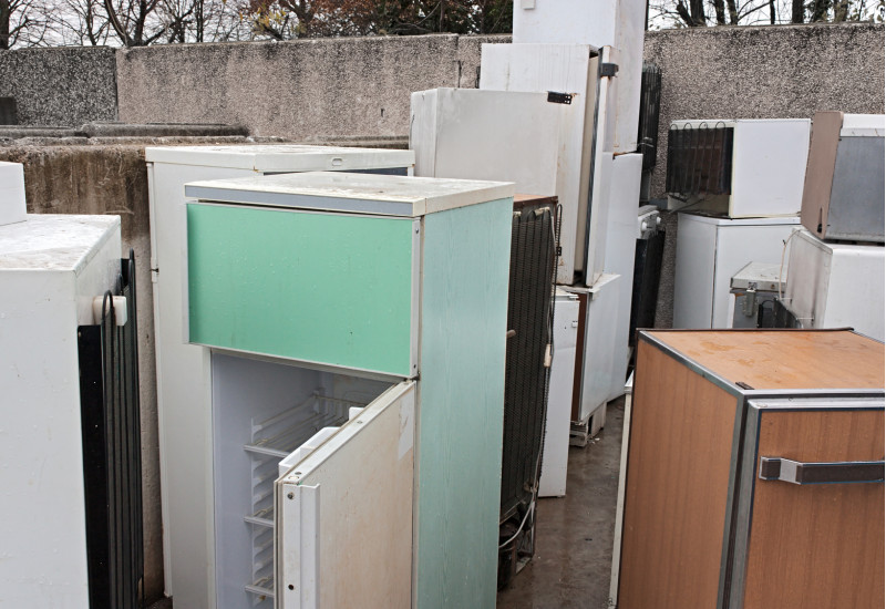 Old refrigerators at a recycling facility
