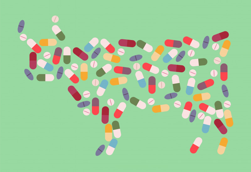 Bunte, illustrierte Pillen und Kapseln bilden die Umrisse einer Kuh vor einem mattgrünem Hintergrund