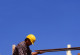 A construction worker lags a slab.