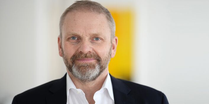 Das Bild zeigt Volker Ratzmann von der DHL Group