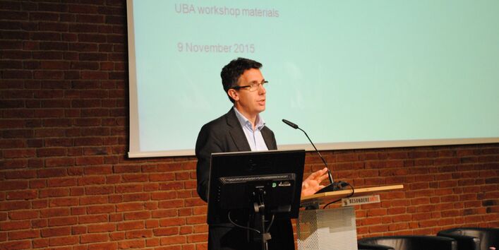 Dan Roberts on a speaker's desk