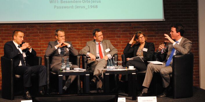 4 men and a woman are discussing on a scene