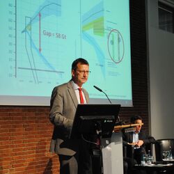 Dr. Benno Hain on a speaker's desk