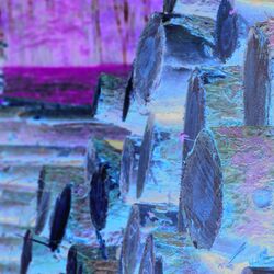 The picture shows a stack of timber.