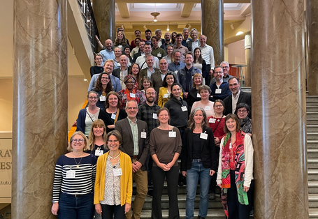On the stairs, 60 people stand for a photo group.