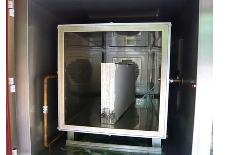 A gypsum board in an emissions testing chamber.