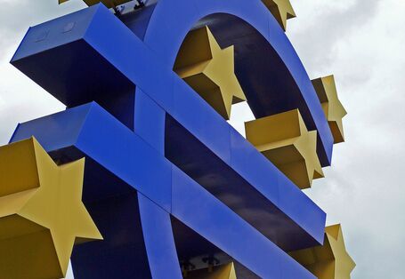 The Euro sign as a plastic figure surrounded by the European stars.
