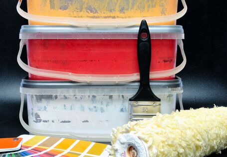 paint buckets, paint brush and paint roller