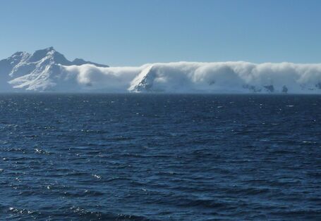 Despite sunshine, mountains near the coast are often hidden by low-lying clouds.
