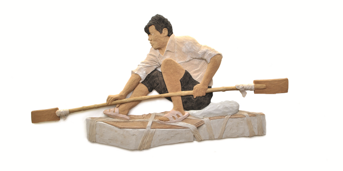 Mann auf einem Floß