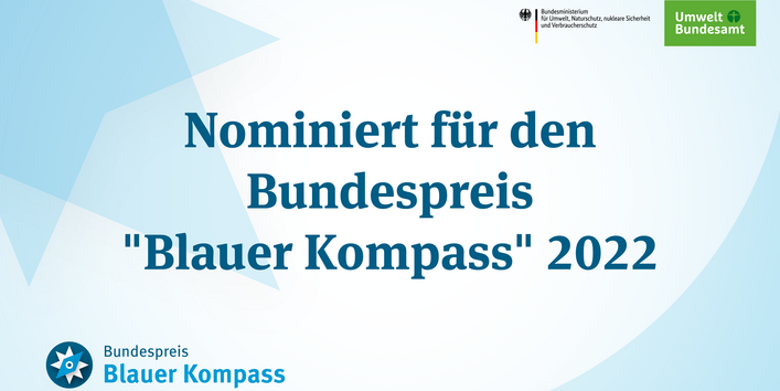 Kompassnadel mit der Aufschrift: Nominiert für den Bundespreis Blauer Kompass