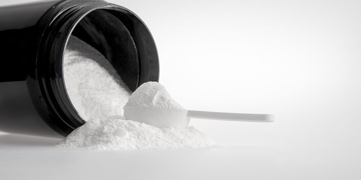 ein weißes Pulver in einer schwarzen Dose