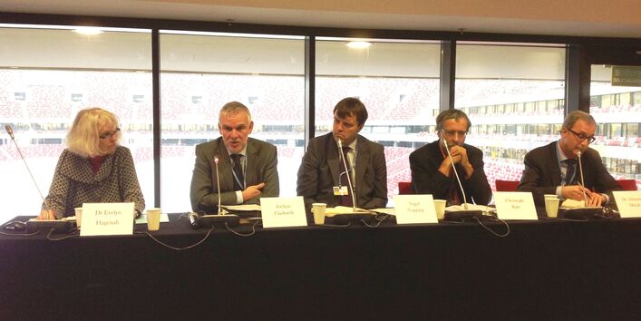 5 speaker on a podium