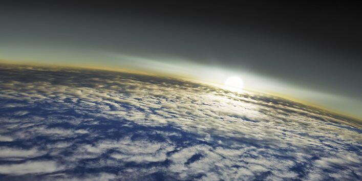 Wolken mit Sonnenaufgang vom All aus